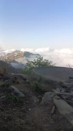 Natural tourist places and landmarks, trees and plants and areas of green nature, agricultural terraces on the mountain slopes, the Jebel Fayfa mountains in Jazan in the south of the Kingdom of Saudi Arabia, peaks and rocky elevations, houses and residential buildings.