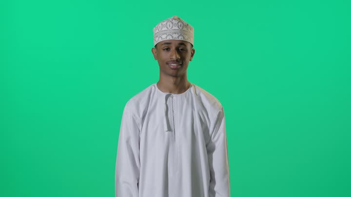 Omani Man Giving Thumbs Up on Green Screen Background