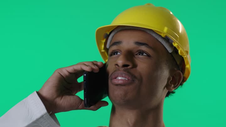 Arab Engineer Talking on Smartphone Against Green Screen