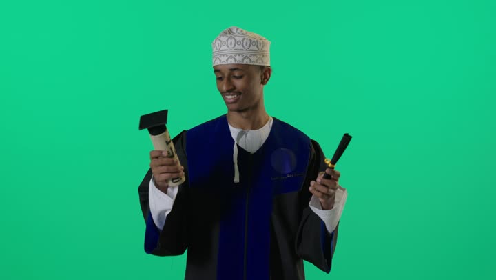 Omani Graduate Celebrating with Diploma on Green Screen