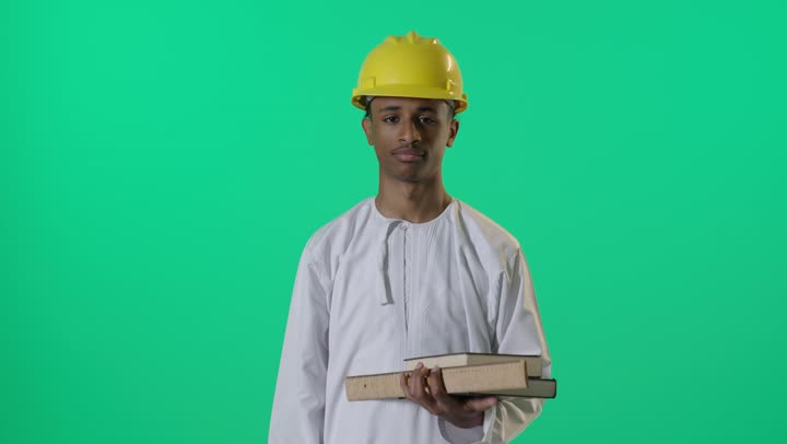 Arab Engineer in Safety Helmet Stop Gesture Green Screen