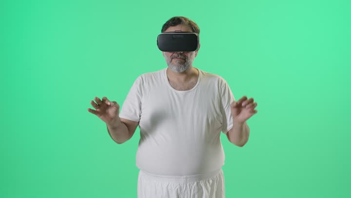 Arab Man Using VR Headset on Green Screen Background
