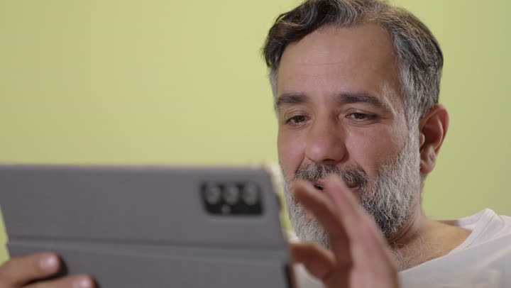 Middle Eastern Man Using Tablet Green Background Clip