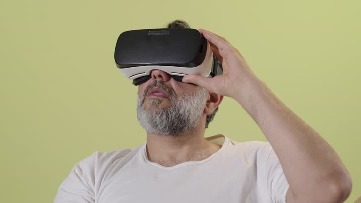 Arab Man Using VR Headset Sitting on Sofa Home Interior
