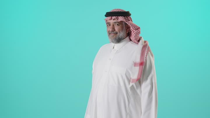 Saudi Man in Traditional Dress Smiling in Studio