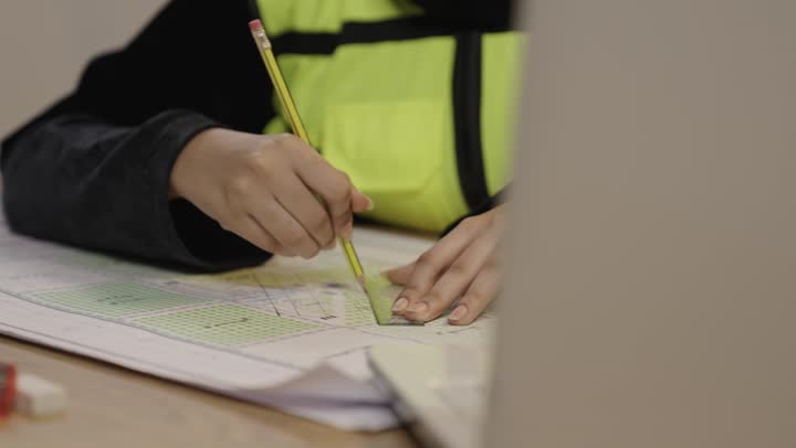 Saudi Female Engineer Drawing Architectural Plans