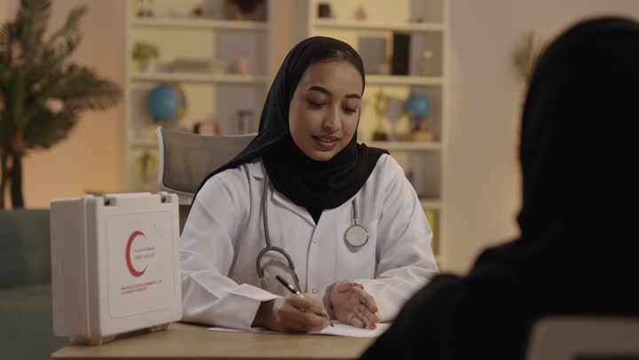 Saudi Female Doctor Medical Consultation in Clinic