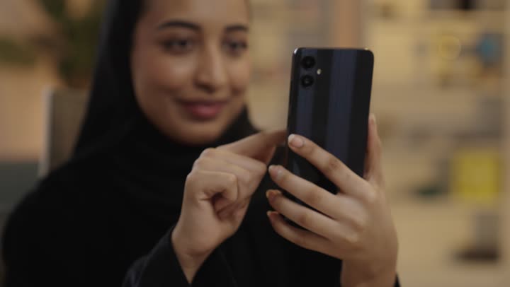 Arab Woman Using Smartphone Indoors Lifestyle Footage