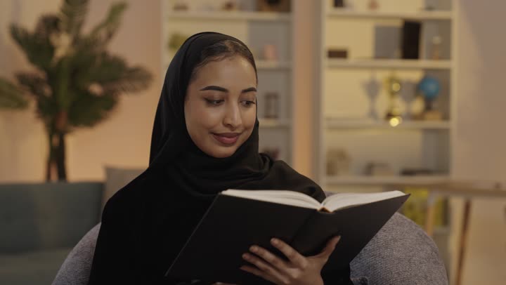 Saudi Woman Reading Book at Home Indoor Footage