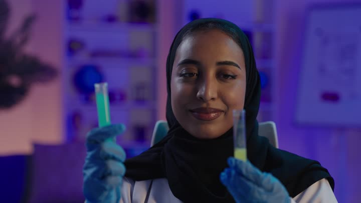 Saudi Female Scientist Working in Laboratory Experiment