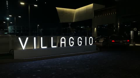 Villaggio Illuminated Sign and Building at Night Qatar