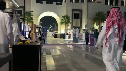 Saudi Men and Women Walking Night Market