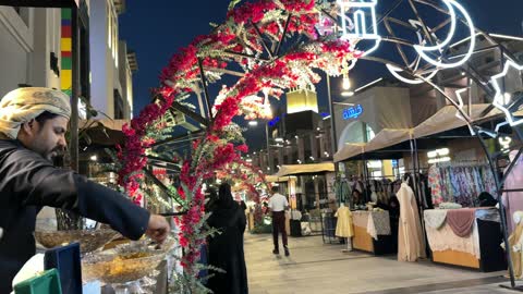 Man at Perfume Stall Villaggio Night Market Saudi Arabia