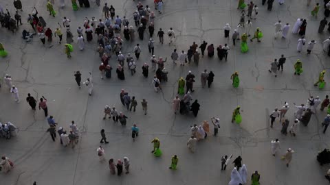 Pilgrims Walking in Mecca Courtyard Aerial View
