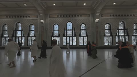 Pilgrims Walking in Mecca Grand Mosque Hallway