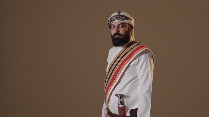 Saudi Man in Traditional Founding Day Attire Crossing Arms