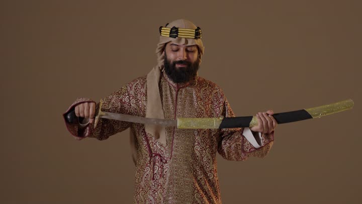 Saudi Man in Founding Day Attire Holding Sword