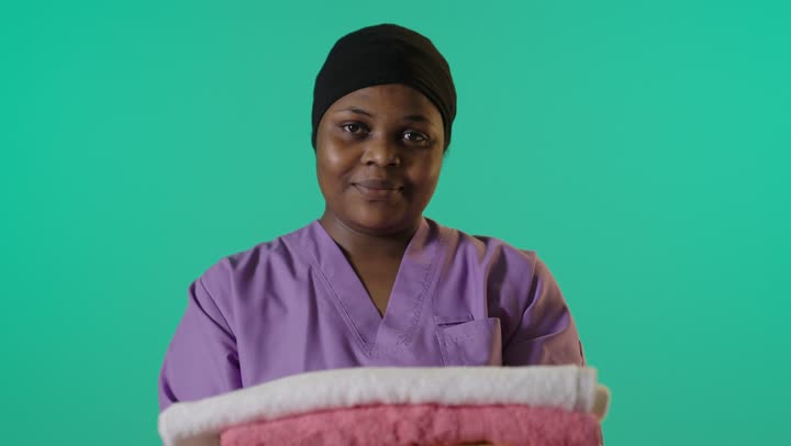 African Housekeeping Staff Holding Towels Green Screen
