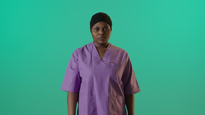 African Female Nurse Green Screen Stop Gesture