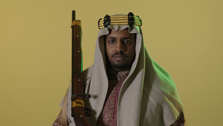 Saudi Man in Founding Day Attire with Rifle Portrait