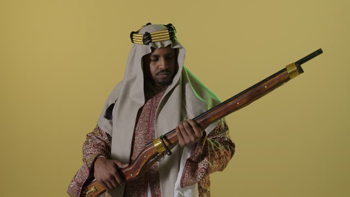 Saudi Man in Founding Day Attire with Rifle