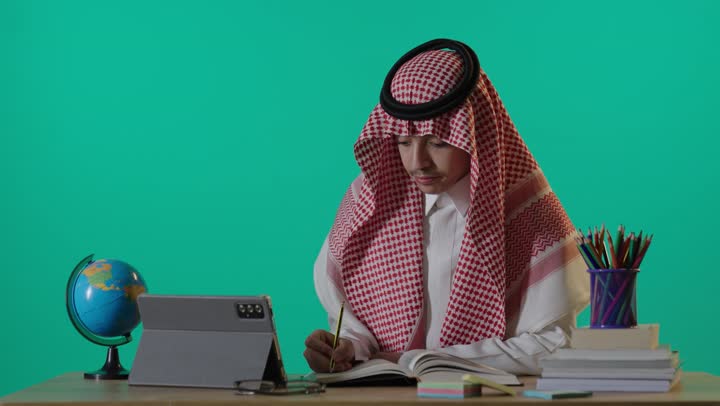Saudi Student Studying with Tablet on Green Screen