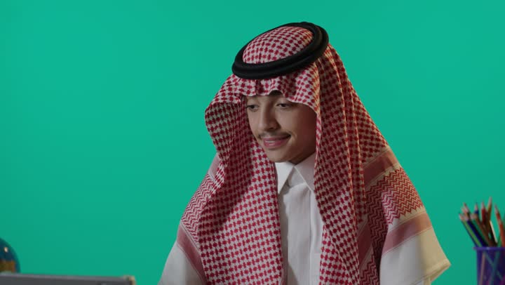 Saudi Student Studying with Tablet on Green Screen