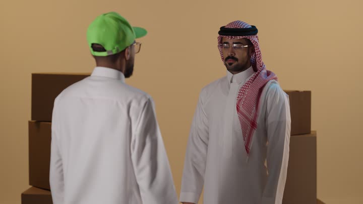 Saudi Man Receiving Delivery Bags Studio Video