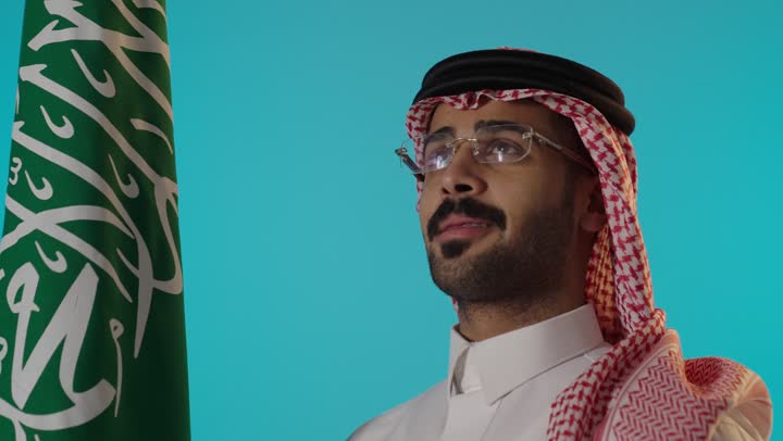 Saudi Man With National Flag Studio Portrait