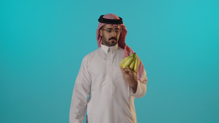 Saudi Man Holding Bananas Thumbs Up Studio Footage