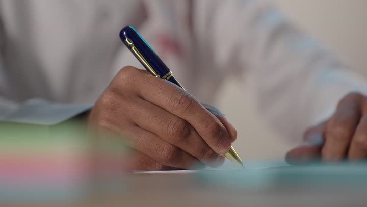 Arab Man Writing with Pen Close-up Office Stock Footage