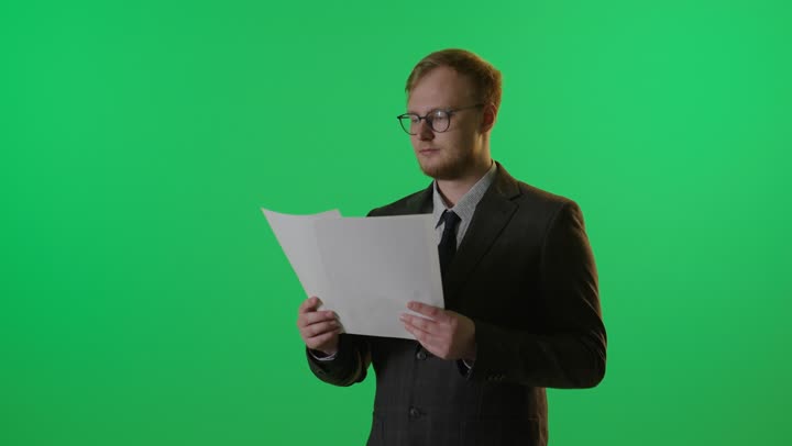 Businessman Reading Documents on Green Screen Footage