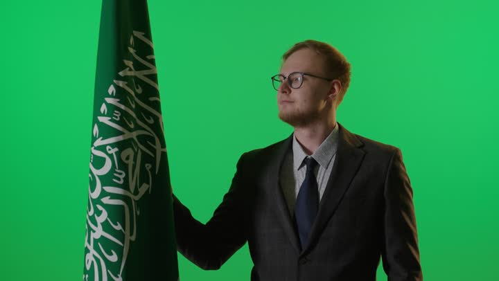 Man with Saudi Arabian Flag on Green Screen