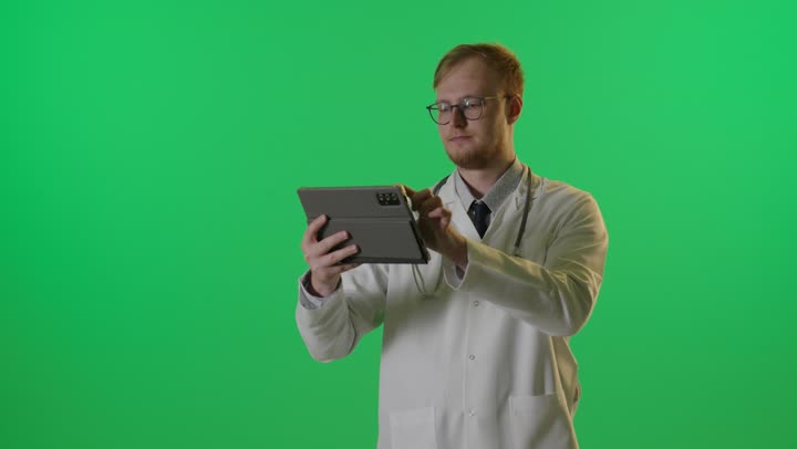 Doctor Using Digital Tablet on Green Screen