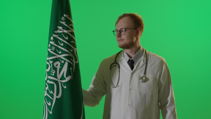 Male Doctor with Saudi Flag on Green Screen
