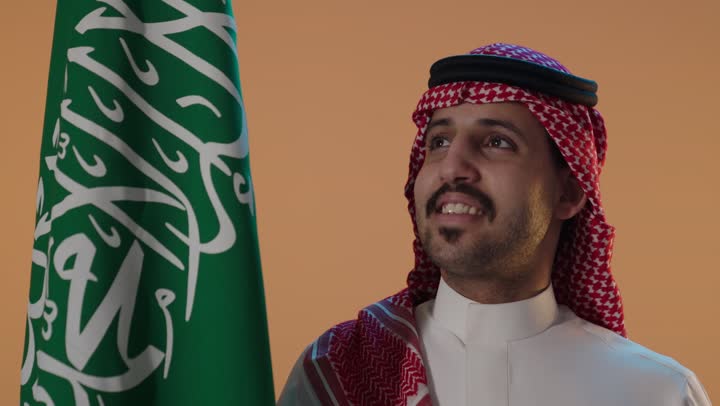 Saudi Man with National Flag Studio Portrait Video