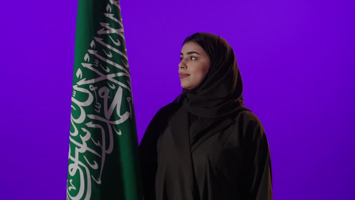Saudi Woman with National Flag Studio Portrait