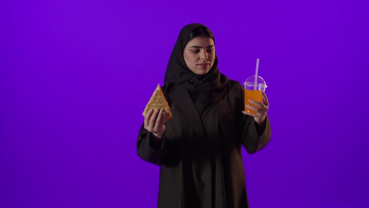 Arab Woman Holding Pizza and Juice Studio Shot