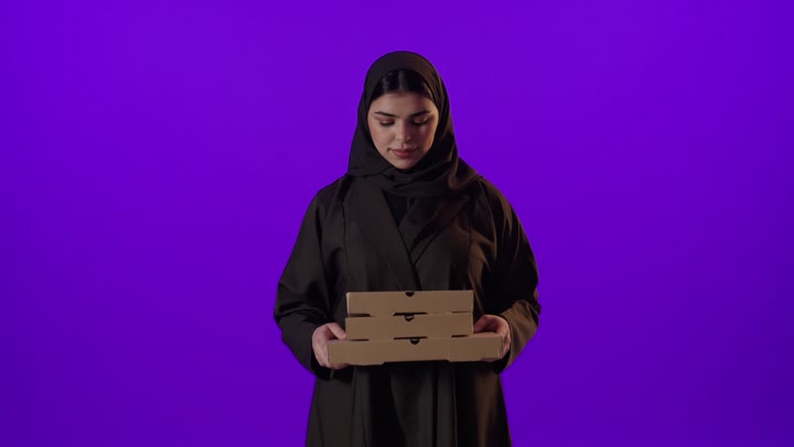 Saudi Woman Holding Pizza Boxes Purple Background