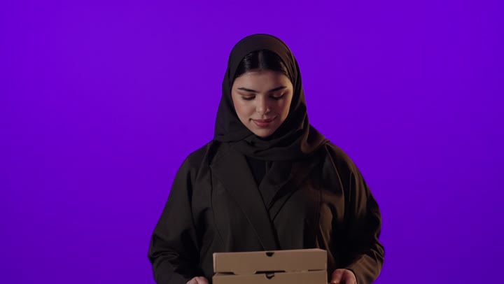 Arab Woman Holding Pizza Boxes on Purple Background