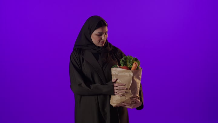 Saudi Woman Holding Grocery Bag Thumbs Up Studio