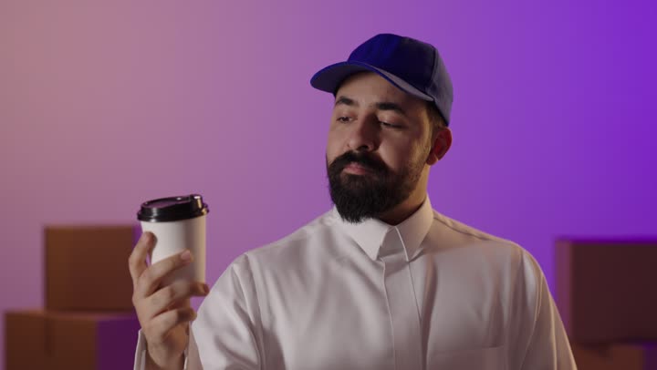 Saudi Delivery Man Holding Shopping Bags and Coffee