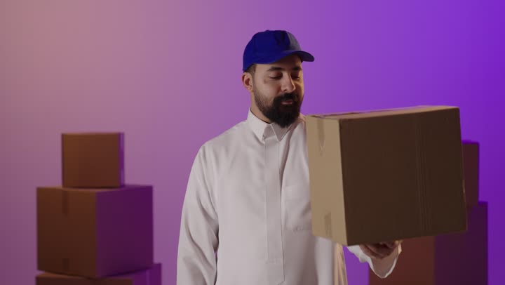 Saudi Delivery Man Holding Box Giving Thumbs Up
