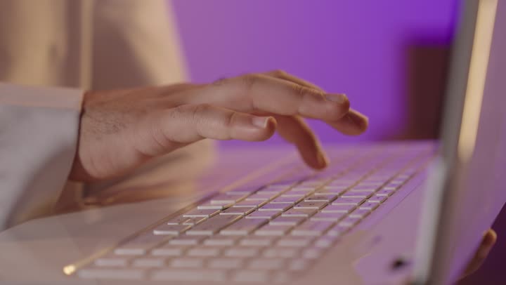Man Typing on Laptop Keyboard Close Up Footage