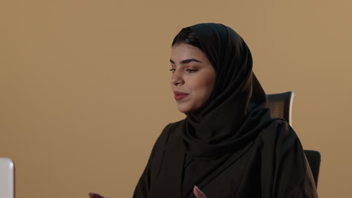 Arab Businesswoman Speaking on Laptop Video Call