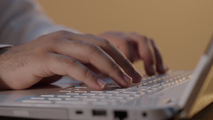 Man Typing on Laptop Keyboard Close Up Footage