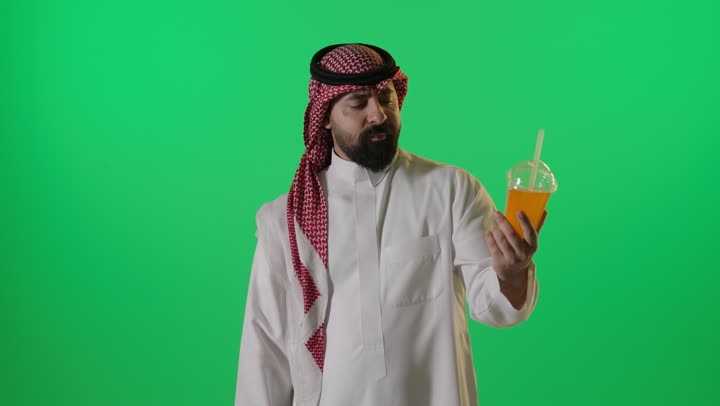 Saudi Man Disliking Orange Juice on Green Screen