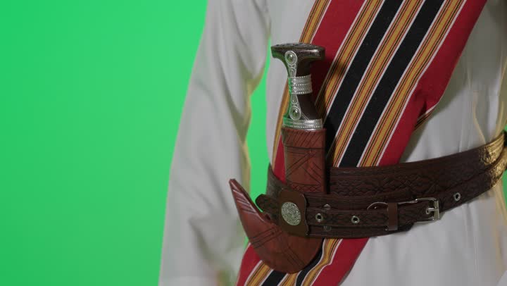 Saudi Man Pulling Janbiya Dagger Green Screen Footage