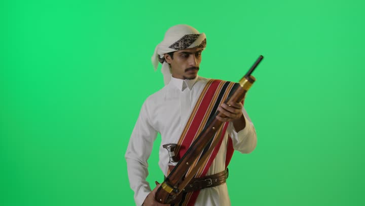 Saudi Man in Traditional Attire with Rifle Chroma Key