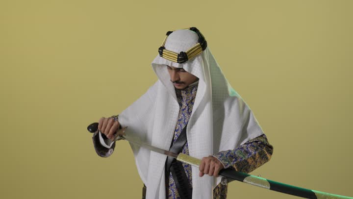 Saudi Man in Traditional Founding Day Attire with Sword